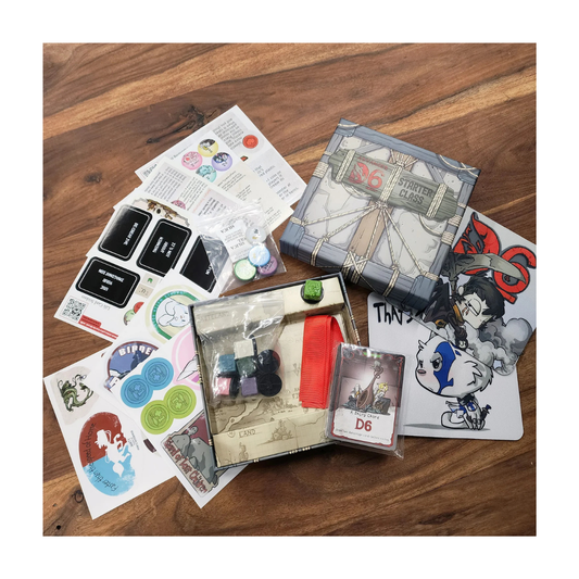 The Advanced D6 Starter Pack components, showing the colored gelatinous cube minis, wooden monster tokens, and the "That's How I Roll" dice tray setup.