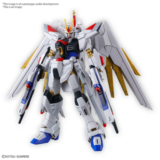 Bandai High Grade 1/144 scale Mighty Strike Freedom Gundam model kit showing the white and gold mobile suit with its wings deployed and physical sword.