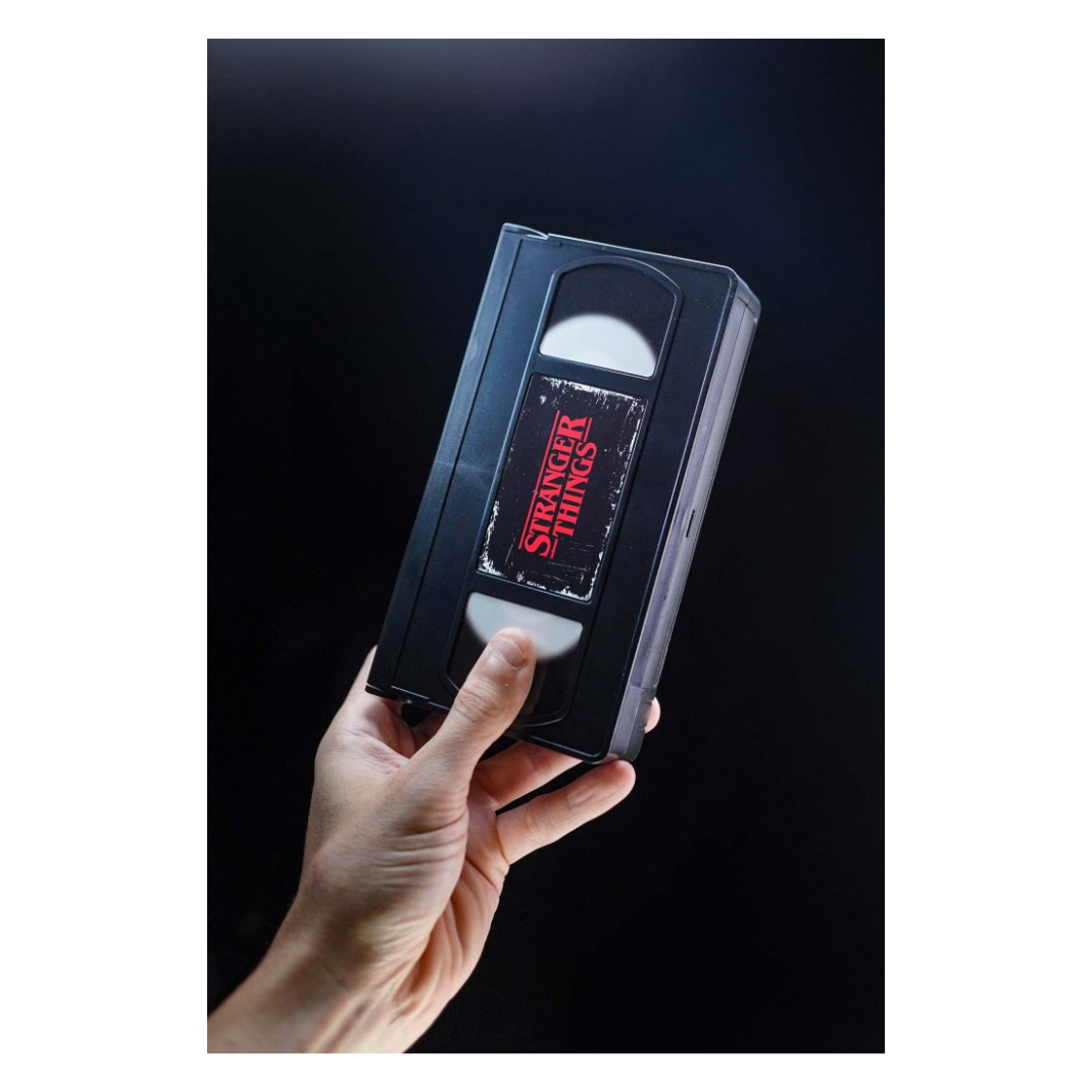 Console Heroes Stranger Things VHS Diorama: Eleven vs. Demogorgon. The collectible is encased in a plastic VHS tape shell, revealing a detailed miniature diorama scene inside the cassette.