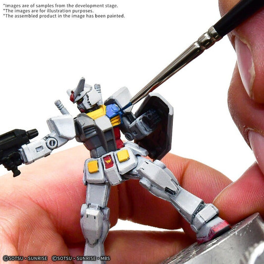 Painting the chest details of a Gundam Assemble RX-78-2 Gundam figure with a fine brush