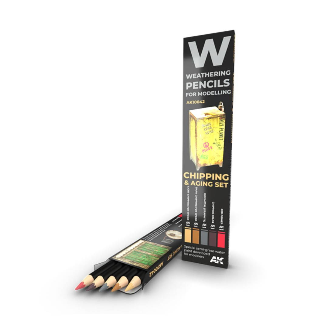 A 5-pack of AK Interactive weathering pencils for chipping and aging, featuring dark brown, grey, and metallic tones for scale model weathering.