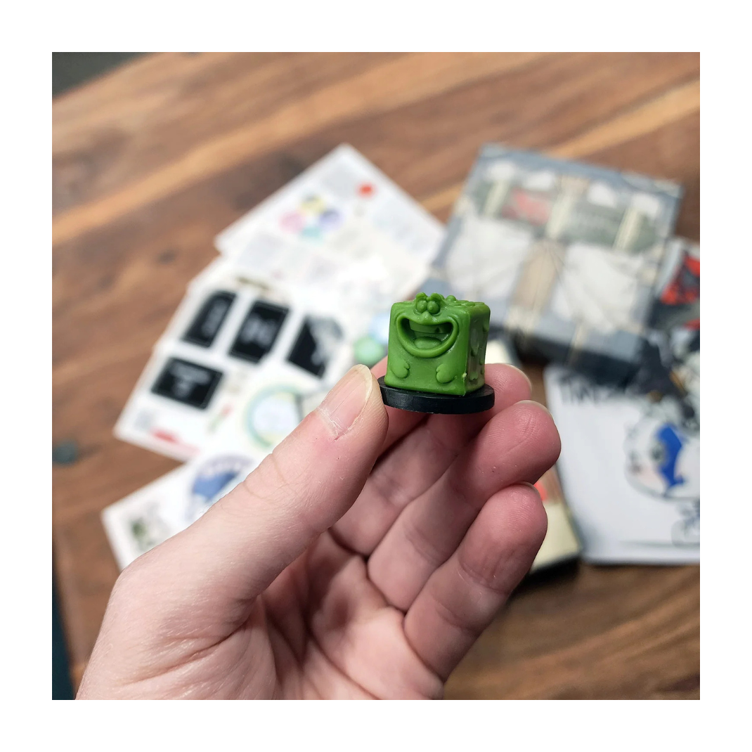 The Advanced D6 Starter Pack components, showing the colored gelatinous cube minis, wooden monster tokens, and the "That's How I Roll" dice tray setup.
