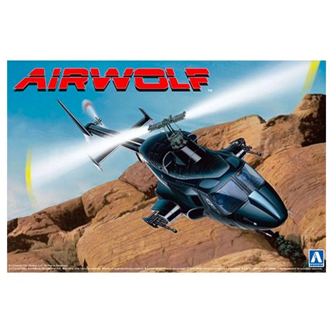 Aoshima 1/48 scale Airwolf model kit showing the clear-bodied helicopter with detailed internal cockpit and weaponry.