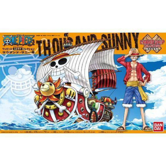 Bandai Grand Ship Collection #01 model kit showing the Thousand Sunny with its lion figurehead and an ocean wave display base.