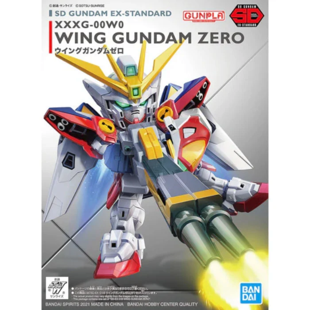 The Bandai SD Gundam EX-Standard Wing Gundam Zero model kit with wings expanded and the Twin Buster Rifle equipped in a firing pose.