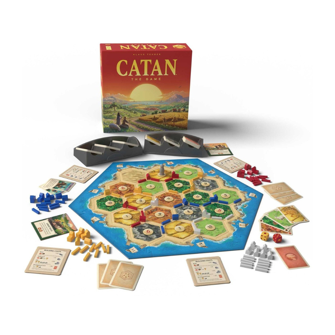 Catan board game set with pieces and cards on a white background