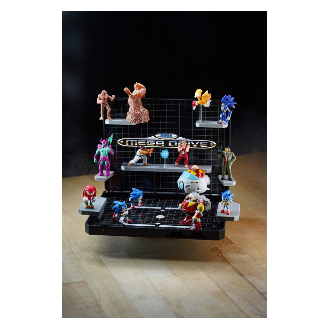 Console Heroes: Sega Mega Drive Display Console Supervillain Boss Bundle, shown open to display the included figures (Mecha Sonic, Mecha Robotnik, Mr. X, Death Bringer) and the exclusive Sonic the Hedgehog 1 diorama cartridge.