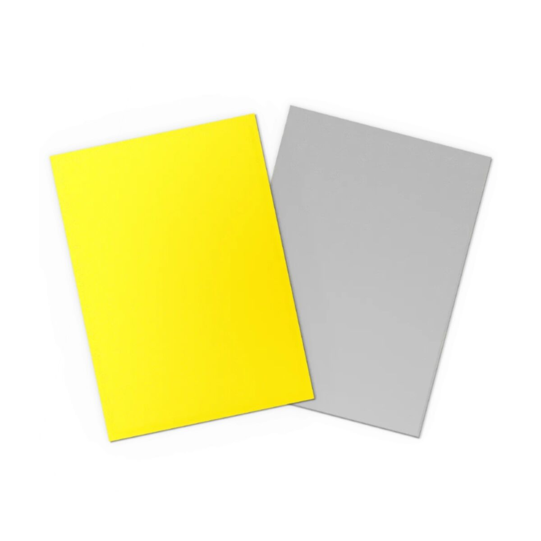 A standard-sized trading card inside a Yellow Matte Dual sleeve, highlighting the silver interior border.