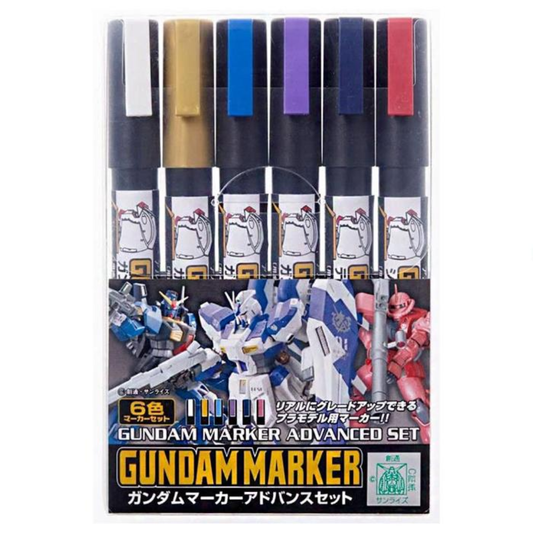 A pack of six G-Tool Gundam Marker Advanced Set (GMS124) markers featuring specialized colors like New White, Red Gold, and Titans Blue on the packaging.