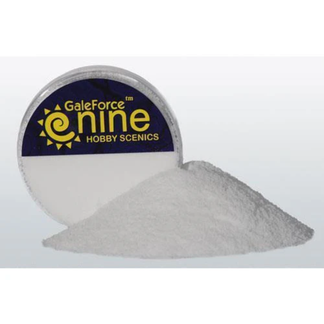 A container of Gale Force Nine Hobby Snow (GFS027) showing the fine white realistic snow texture used for basing wargaming miniatures.