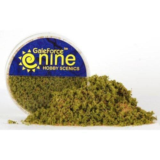 A container of Gale Force Nine Spring Undergrowth (GFS010) showing the vibrant bright green foliage texture used for realistic miniature basing and forest effects.