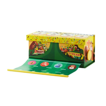 The unique pull-out racetrack extended from the box with mascot figures in mid-race.