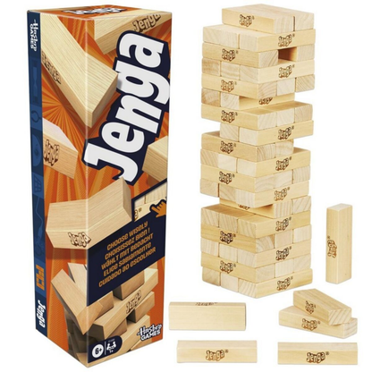 The original Jenga game featuring a tall tower of wooden blocks on a flat surface, showing the iconic stacking gameplay.