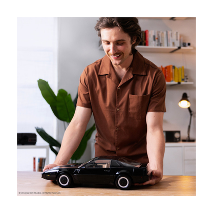 High-quality 1:10 scale replica model of the black Pontiac Trans Am K.I.T.T. from the television show Knight Rider, showing the illuminated red scanner light on the front grille.