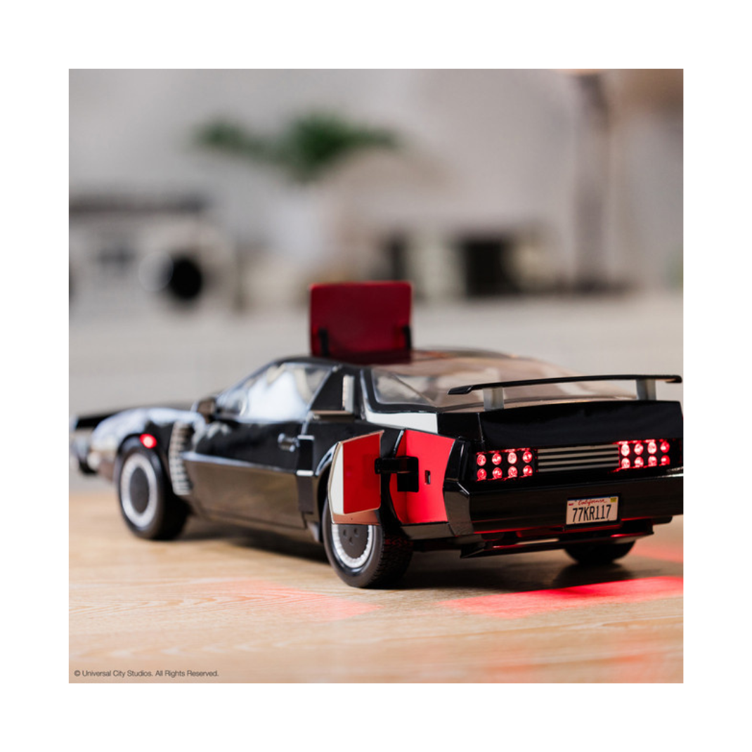 High-quality 1:10 scale replica model of the black Pontiac Trans Am K.I.T.T. from the television show Knight Rider, showing the illuminated red scanner light on the front grille.