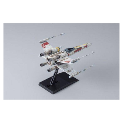 Bandai Star Wars Vehicle Model 002 X-Wing Starfighter plastic model kit, featuring the T-65 starfighter with open S-foils mounted on its black display stand.
