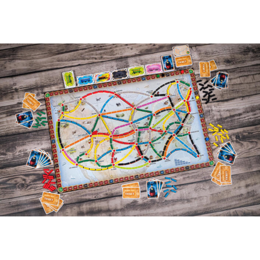 The North American map board spread out with colorful plastic trains claiming routes between cities.