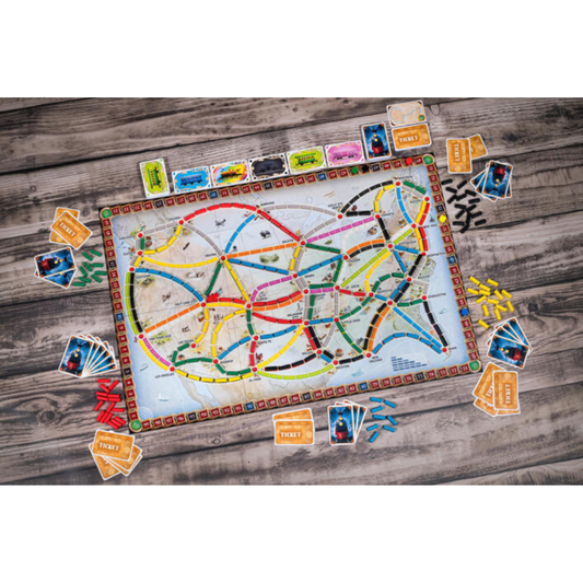 The North American map board spread out with colorful plastic trains claiming routes between cities.