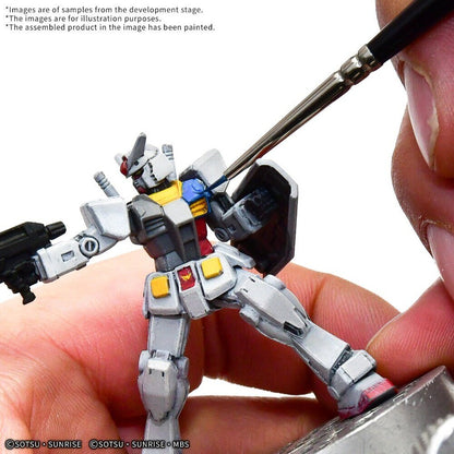 Painting the chest details of a Gundam Assemble RX-78-2 Gundam figure with a fine brush